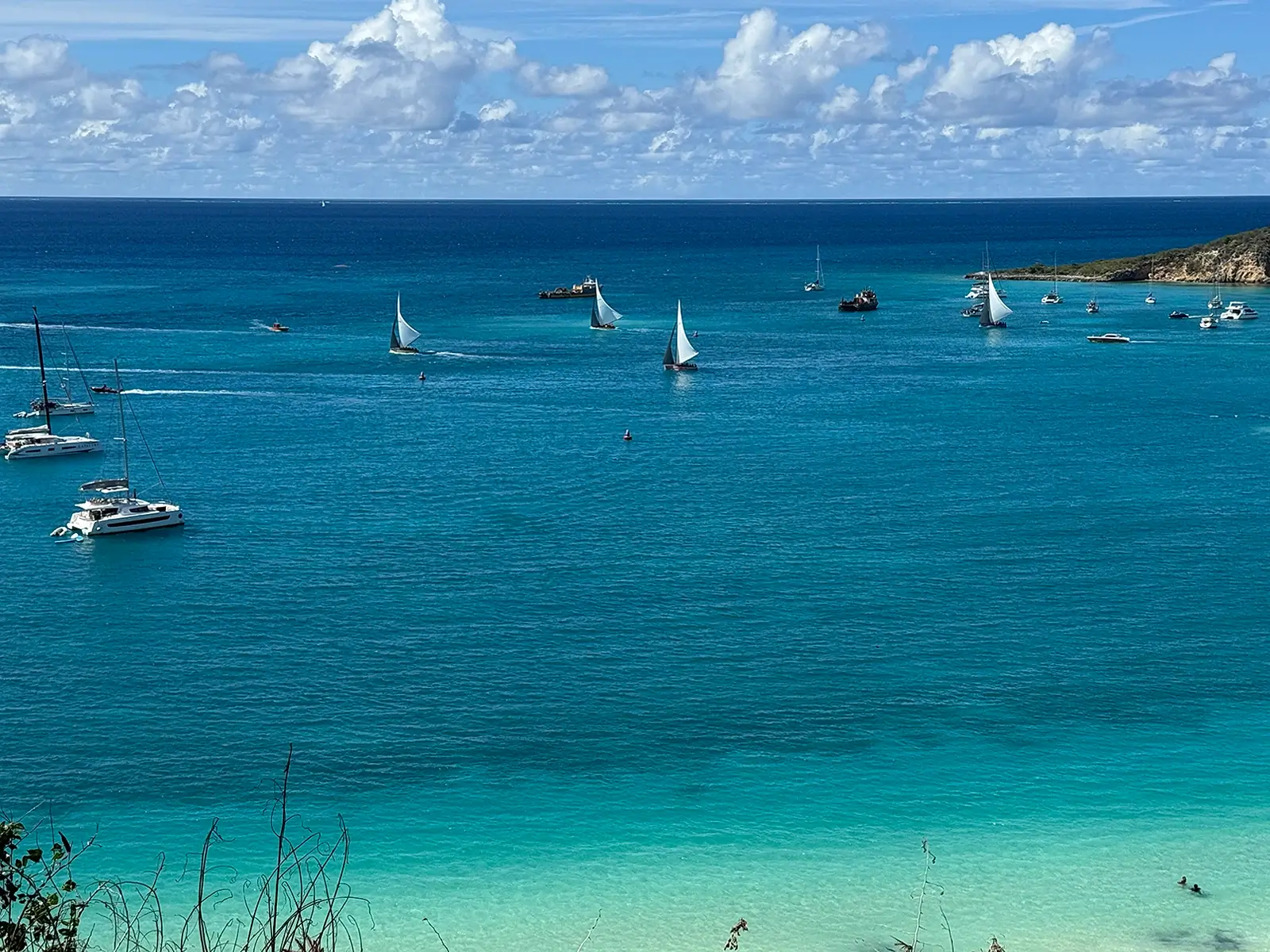 Aerial view of Anguilla's coastline — clear turquoise water, white sand beach, calm Caribbean sea